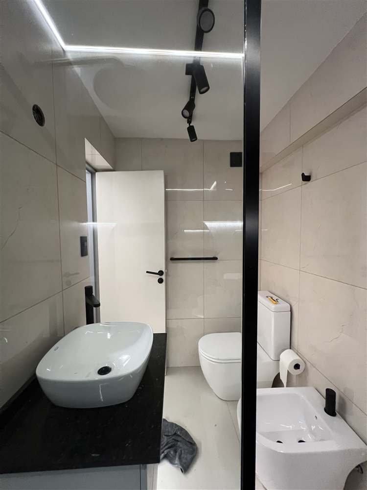 Baño remodelado, después